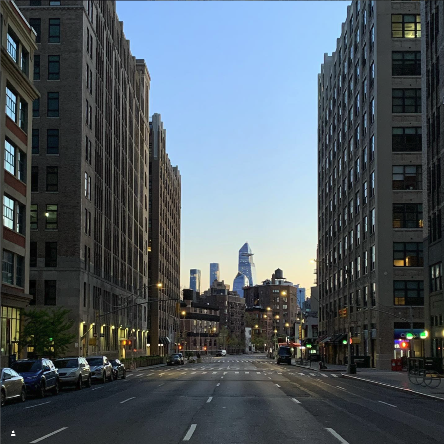A Manhattan avenue at dawn looking toward Hudson Yards